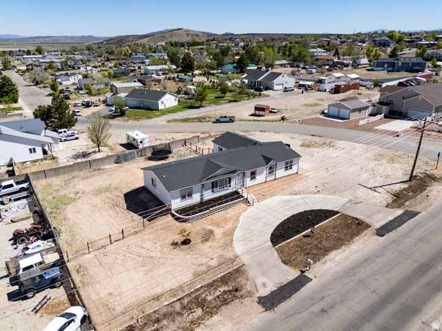 1637 East Midvalley Road Enoch, UT 84721 - Photo 42 of 48 White exterior with a dark shingle roof and an inviting front porch