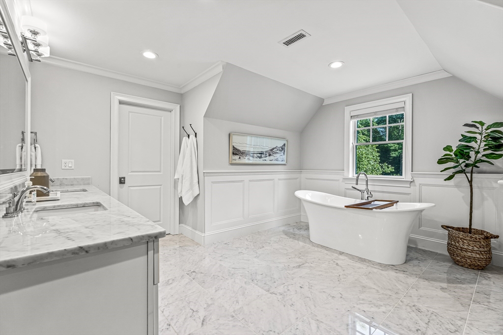 46 Pilgrim Road Wellesley, MA 02481 - Photo 15 of 35 a spacious bathroom with a bathtub a sink and a window