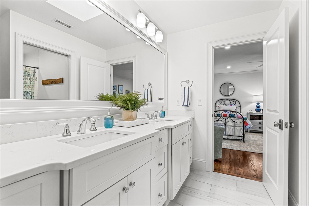 46 Pilgrim Road Wellesley, MA 02481 - Photo 21 of 35 a bathroom with a sink and a mirror