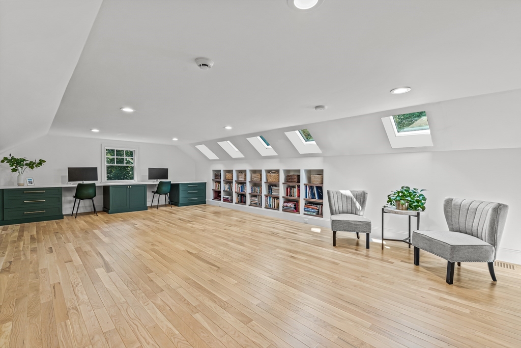 46 Pilgrim Road Wellesley, MA 02481 - Photo 23 of 35 a big room with wooden floor and furniture