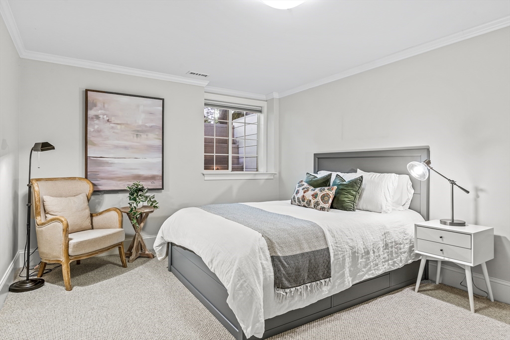 46 Pilgrim Road Wellesley, MA 02481 - Photo 27 of 35 a bedroom with a bed and a chair
