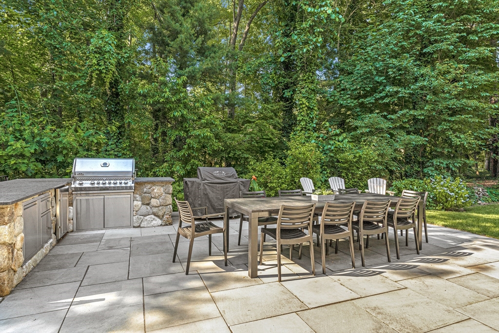 46 Pilgrim Road Wellesley, MA 02481 - Photo 31 of 35 a view of a dinning table and chairs in the patio