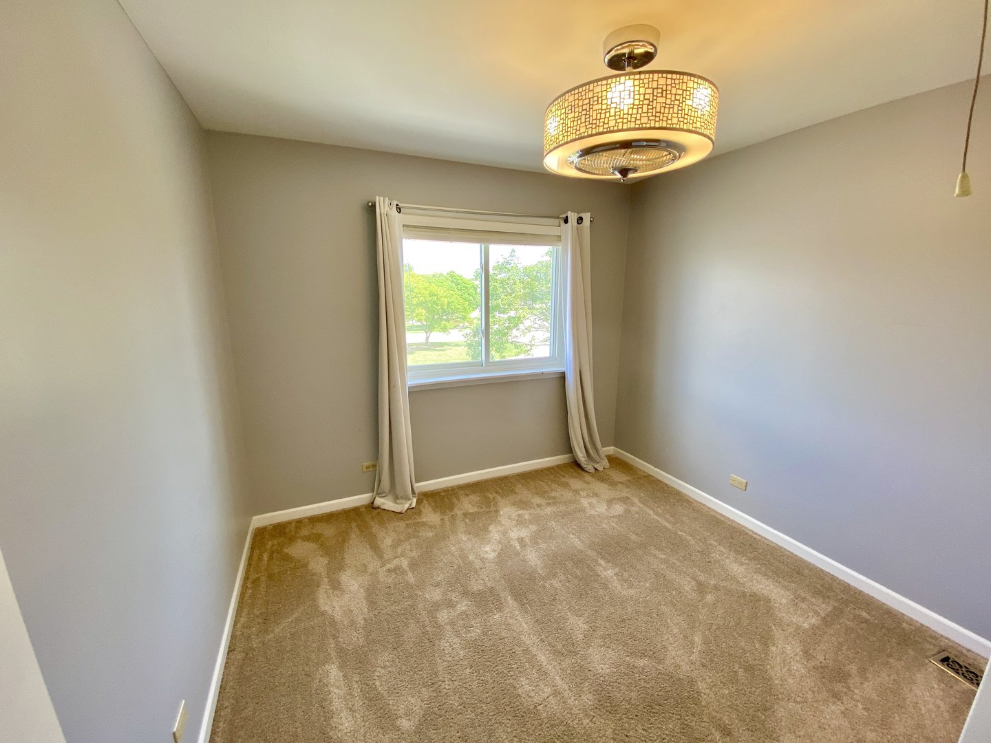 1534 Cornell Circle, Unit 34D Hoffman Estates, IL 60169 - Photo 12 of 15 an empty room with a window