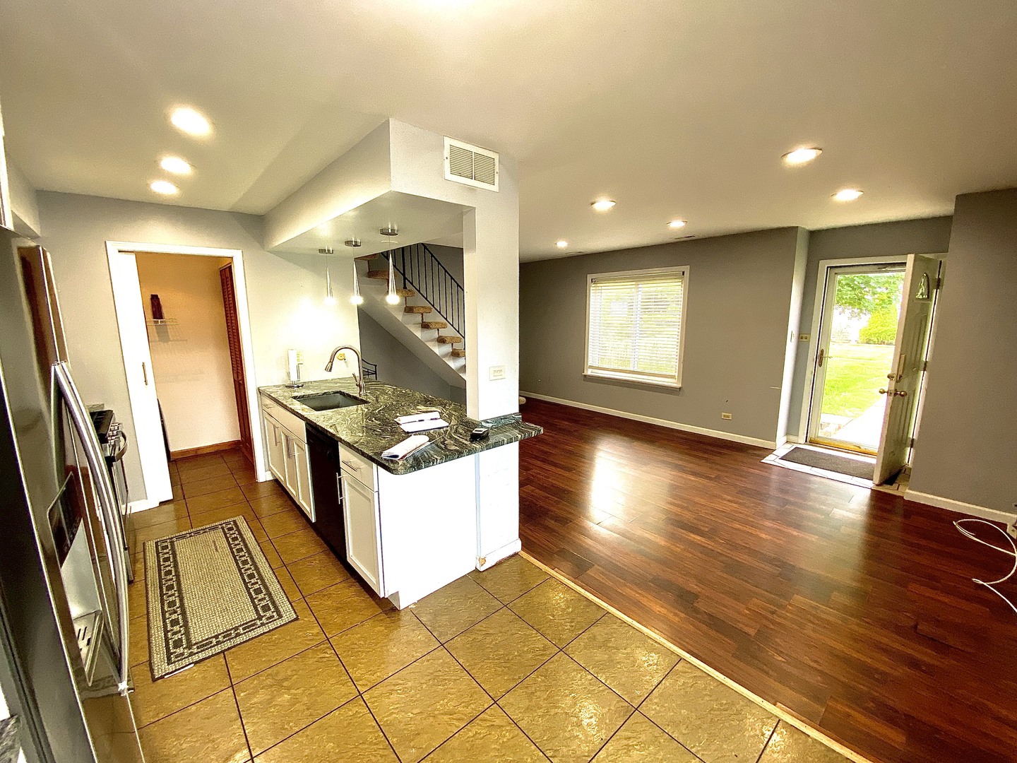 1534 Cornell Circle, Unit 34D Hoffman Estates, IL 60169 - Photo 3 of 15 a kitchen with stainless steel appliances granite countertop a sink and a stove