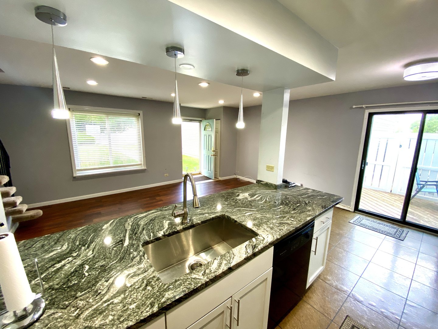 1534 Cornell Circle, Unit 34D Hoffman Estates, IL 60169 - Photo 4 of 15 a bathroom with a granite countertop sink and a large mirror
