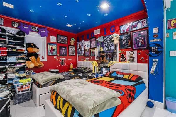 a bedroom with a bed and a gym equipment