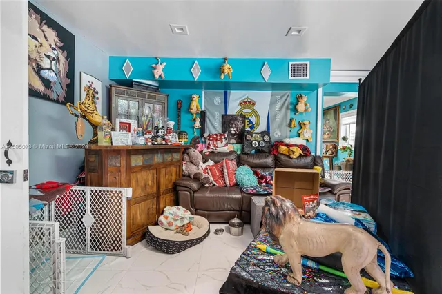 a store area with lots of different colored cloths and chairs