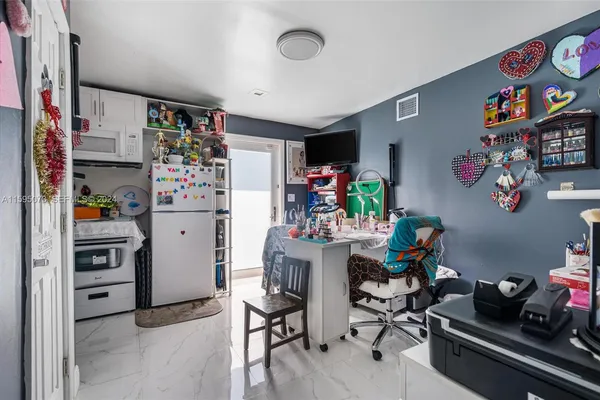 a white refrigerator freezer sitting in a kitchen