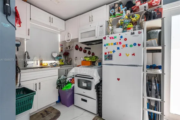 a bathroom with a sink toilet and a mirror