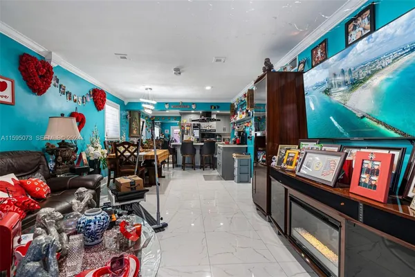 a living room with lots of furniture and a flat screen tv