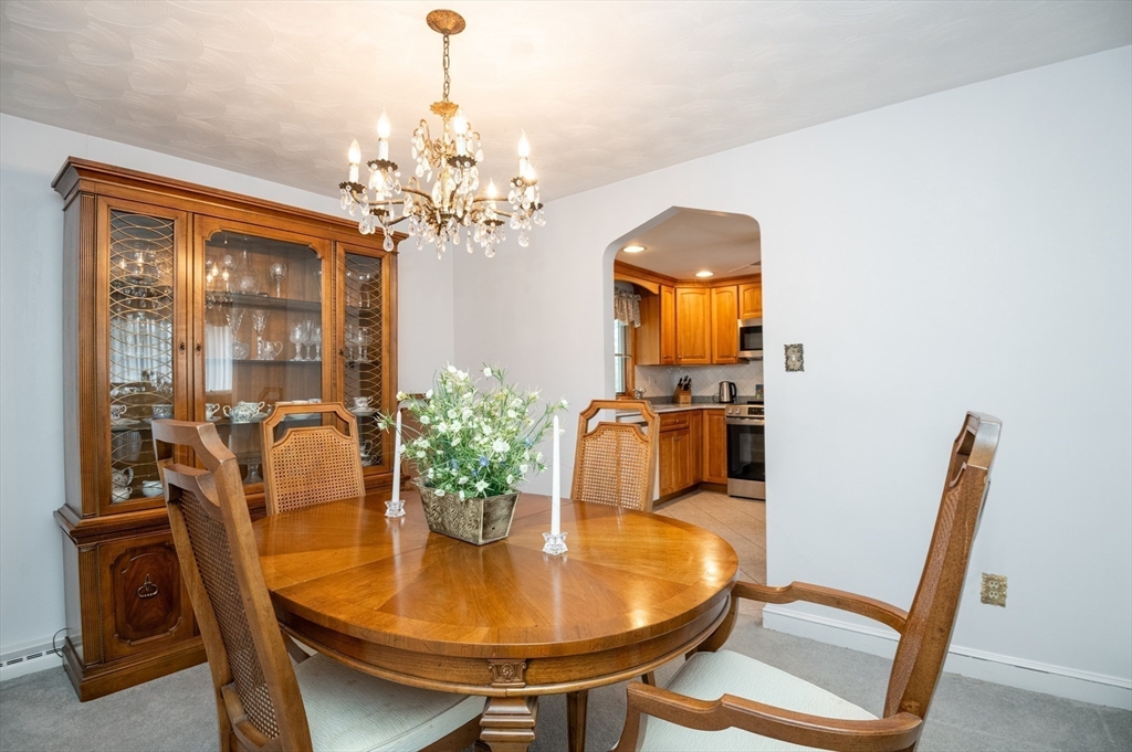 6 Janice Lane Stoneham, MA 02180 - Photo 12 of 35 a dining room with furniture and chandelier