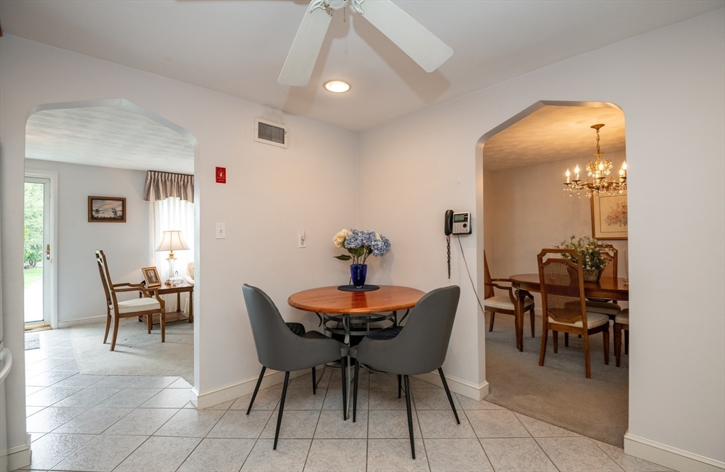 6 Janice Lane Stoneham, MA 02180 - Photo 16 of 35 a dining room with furniture and a chandelier