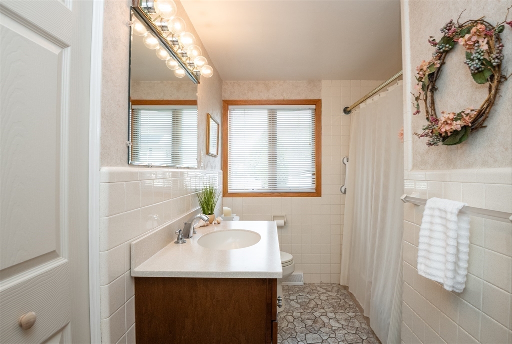 6 Janice Lane Stoneham, MA 02180 - Photo 18 of 35 a bathroom with a sink and a mirror