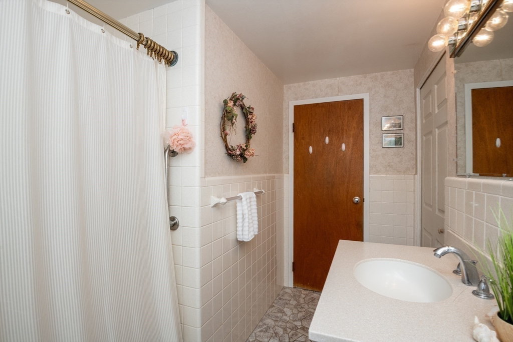 6 Janice Lane Stoneham, MA 02180 - Photo 19 of 35 a bathroom with a sink and a mirror