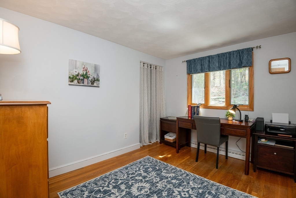 6 Janice Lane Stoneham, MA 02180 - Photo 20 of 35 a view of a workspace with furniture and a window