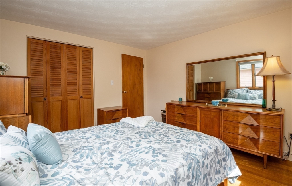 6 Janice Lane Stoneham, MA 02180 - Photo 23 of 35 a bedroom with a large bed and a dresser