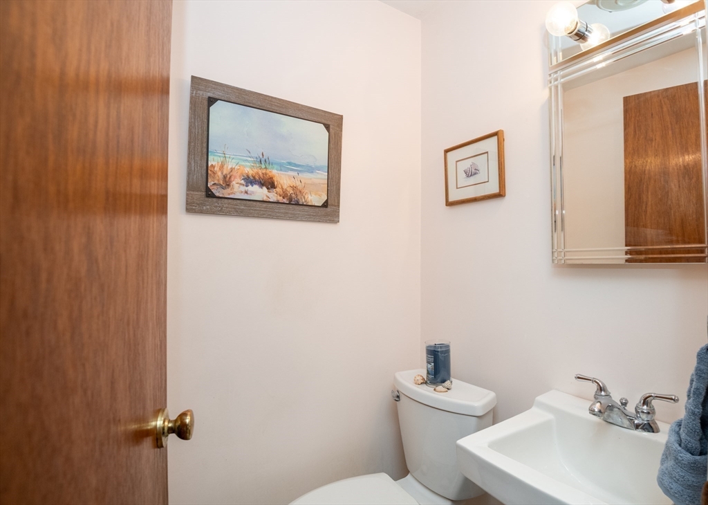 6 Janice Lane Stoneham, MA 02180 - Photo 28 of 35 a bathroom with a sink mirror and toilet
