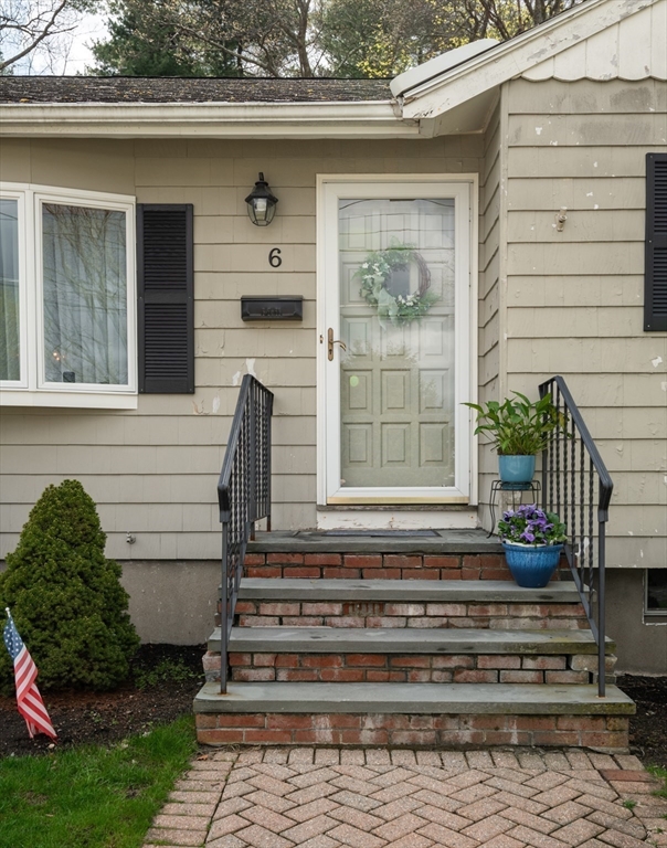 6 Janice Lane Stoneham, MA 02180 - Photo 5 of 35 a front view of a house with a garden