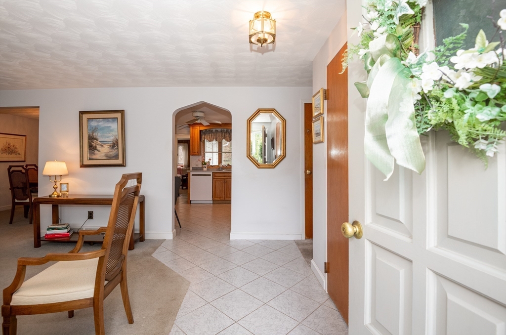 6 Janice Lane Stoneham, MA 02180 - Photo 6 of 35 a view of a livingroom with furniture and a chandelier