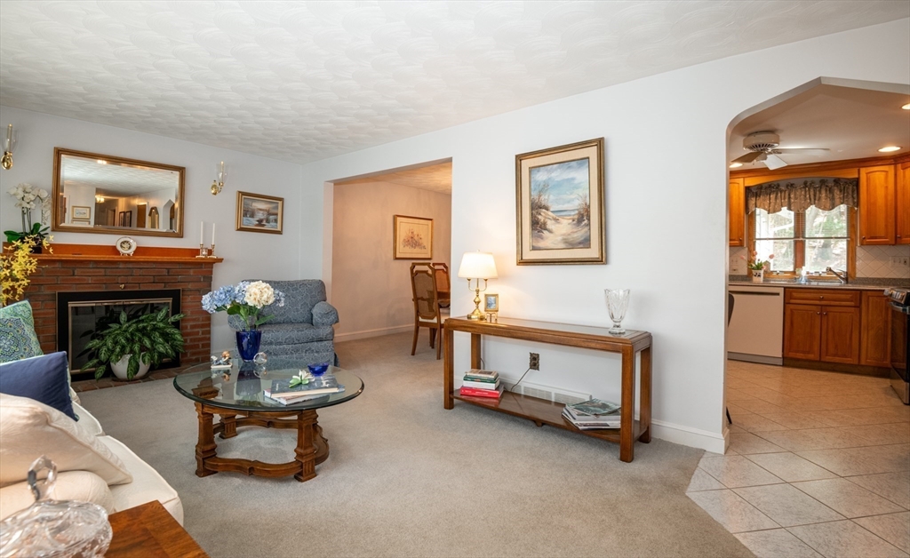 6 Janice Lane Stoneham, MA 02180 - Photo 7 of 35 a living room with furniture and a fireplace
