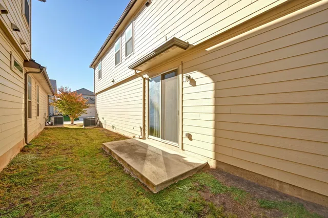 a view of a back yard of the house