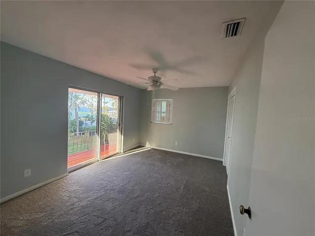 a view of an empty room with a fireplace