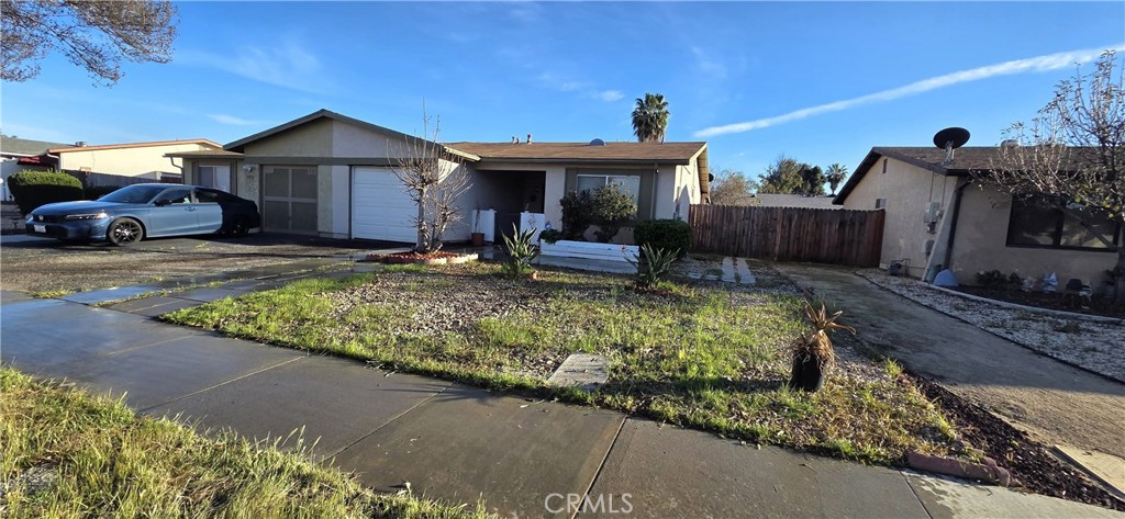 1933 Nuevo Street Hemet, CA 92545 - Photo 1 of 1 a front view of a house with garden
