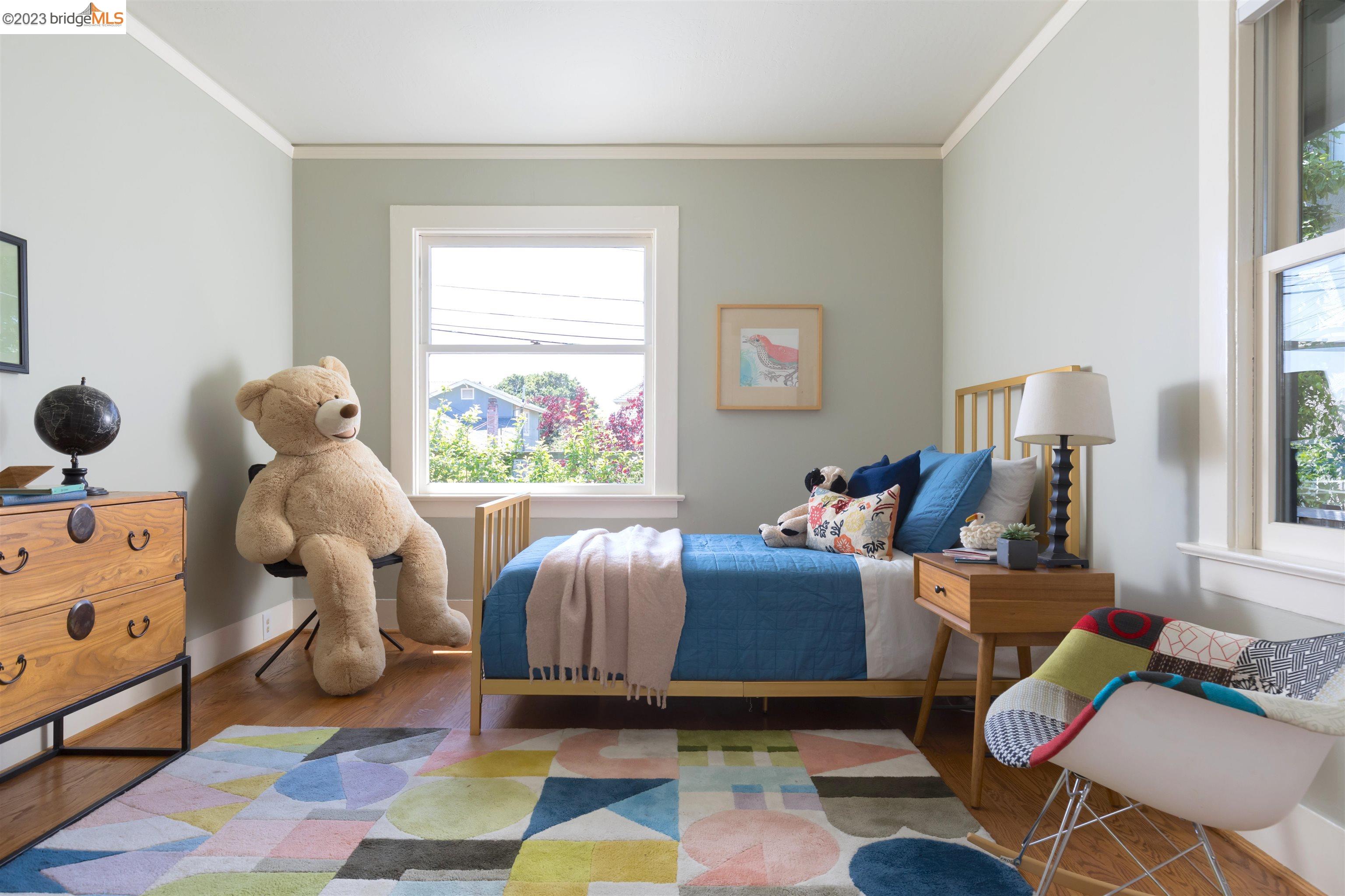 911 Tulare Avenue Berkeley, CA 94707 - Photo 16 of 21 a living room with furniture and a window