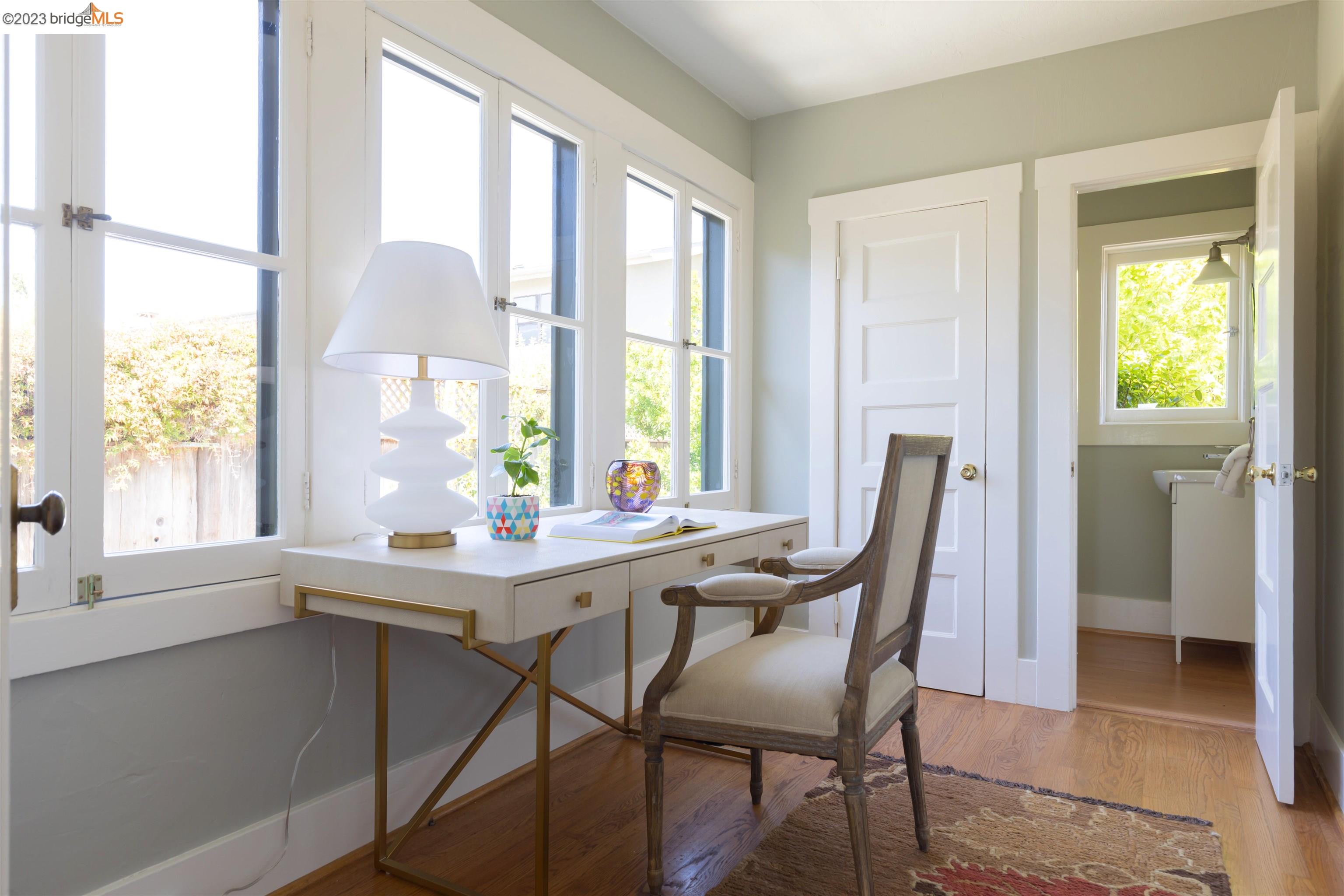 911 Tulare Avenue Berkeley, CA 94707 - Photo 17 of 21 a view of a dining room with furniture and a window