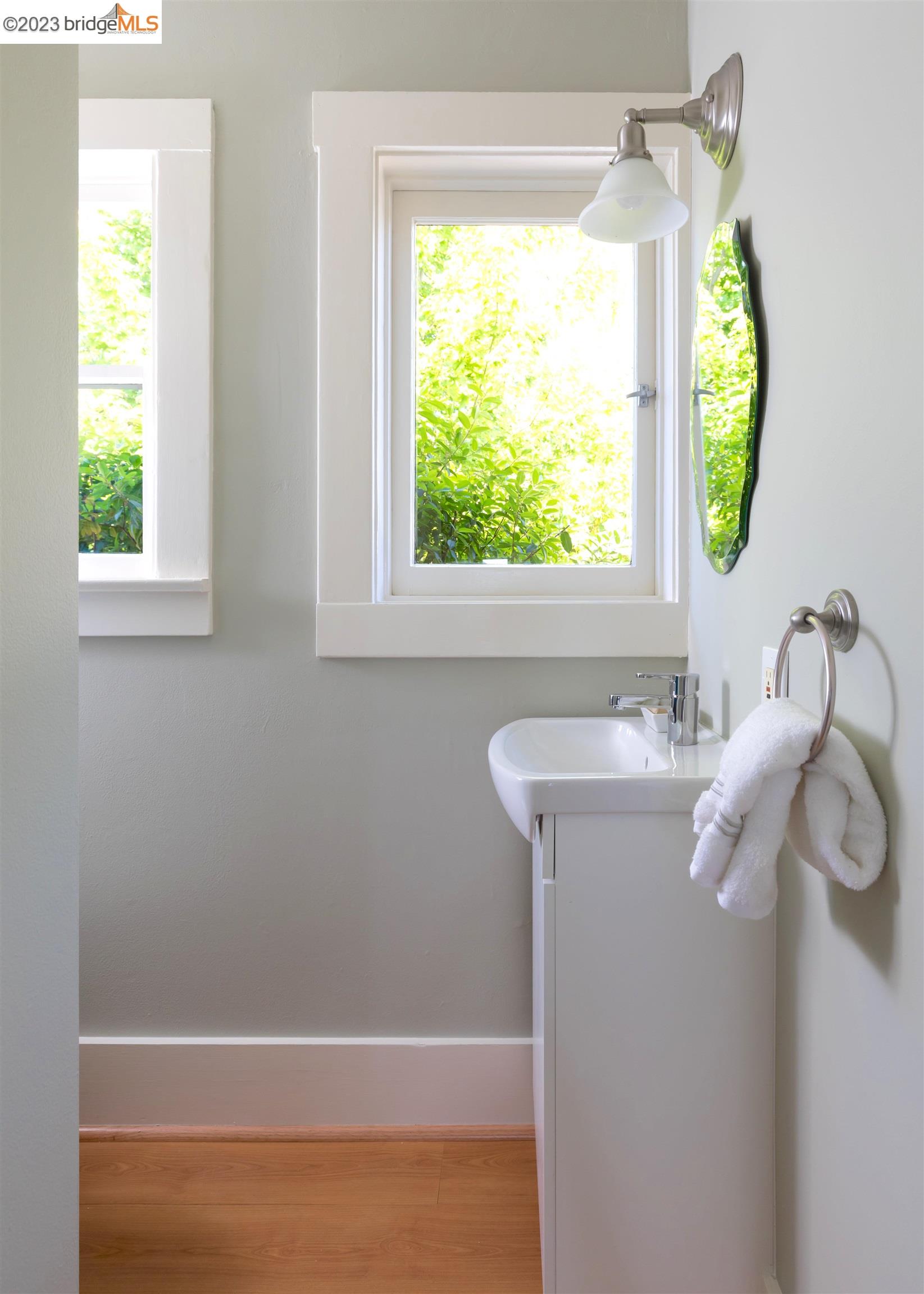911 Tulare Avenue Berkeley, CA 94707 - Photo 18 of 21 a bathroom with a bathtub a shower and a window