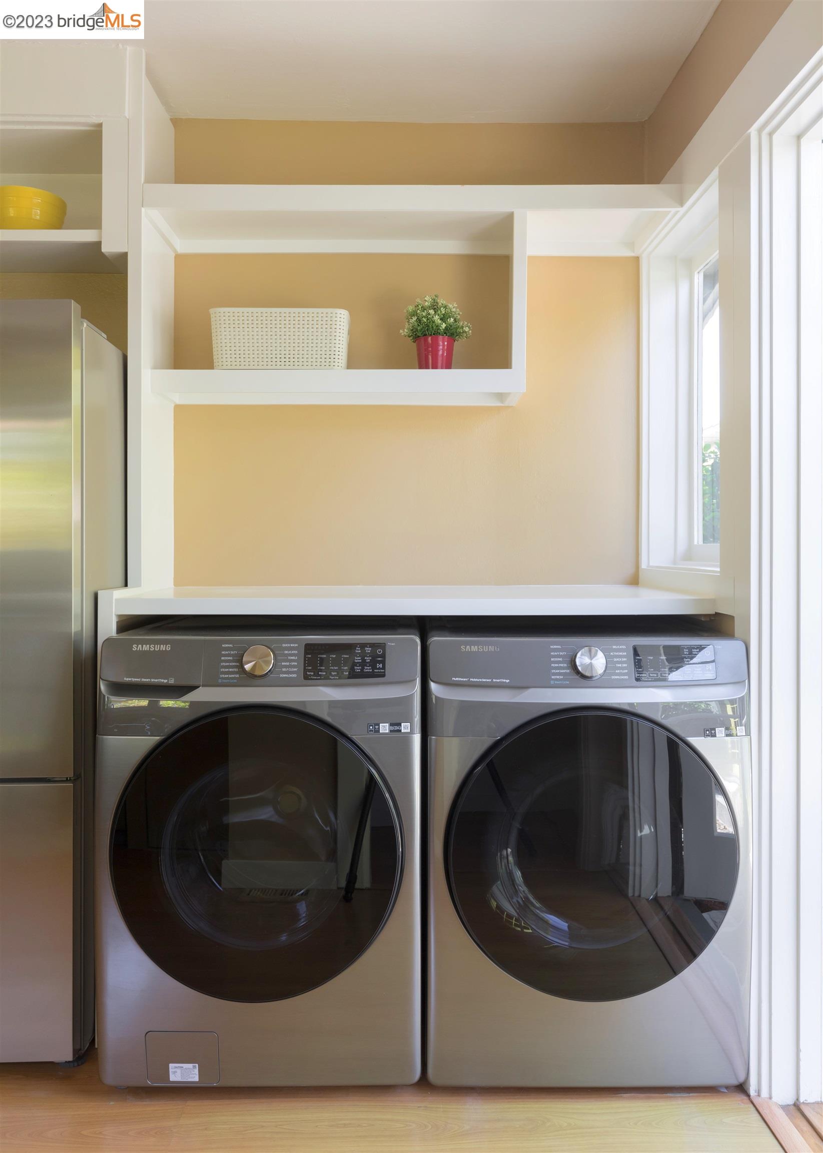 911 Tulare Avenue Berkeley, CA 94707 - Photo 19 of 21 a utility room with dryer and washer