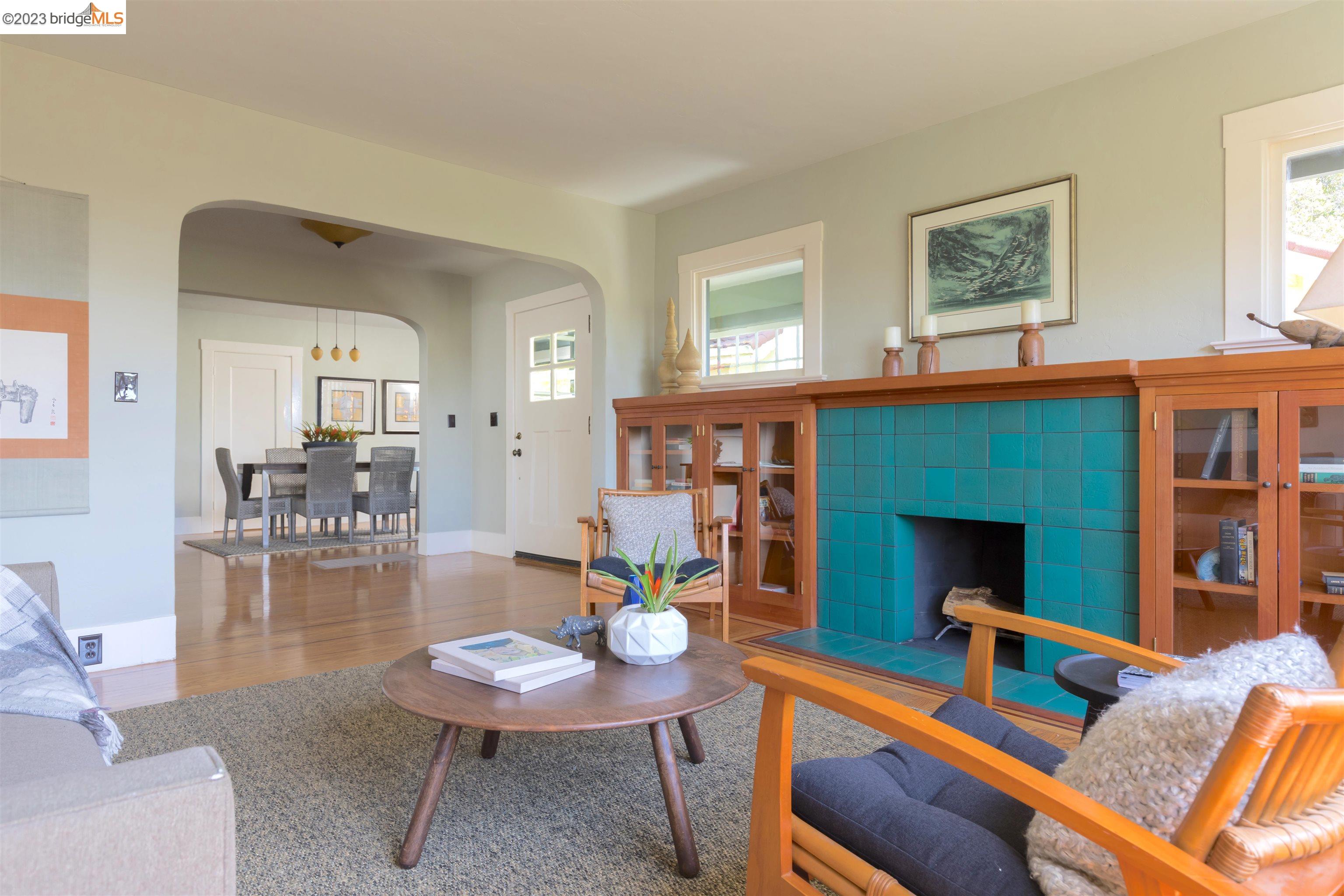 911 Tulare Avenue Berkeley, CA 94707 - Photo 5 of 21 a living room with furniture and a fireplace