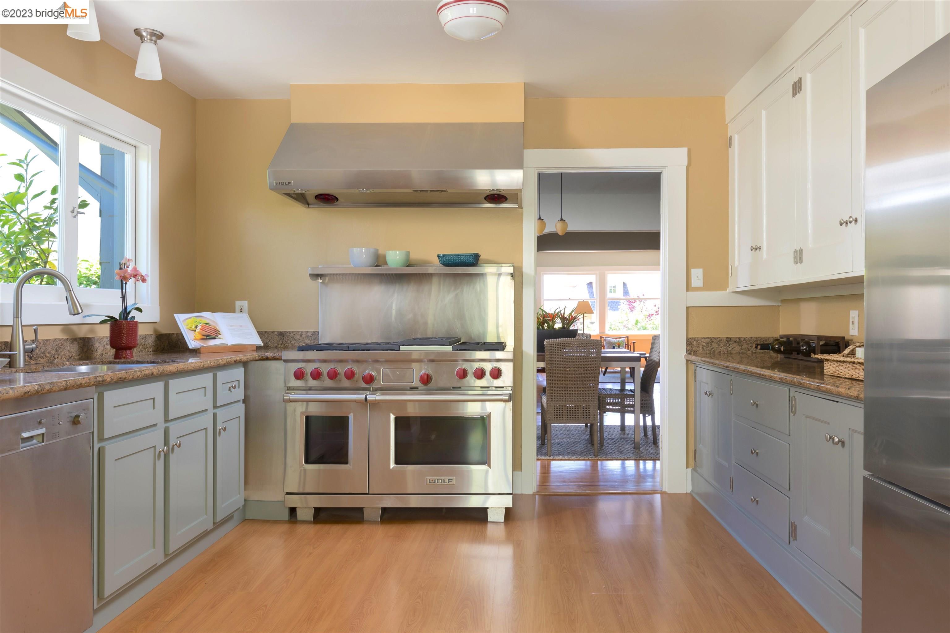 911 Tulare Avenue Berkeley, CA 94707 - Photo 8 of 21 a kitchen with a stove and a refrigerator
