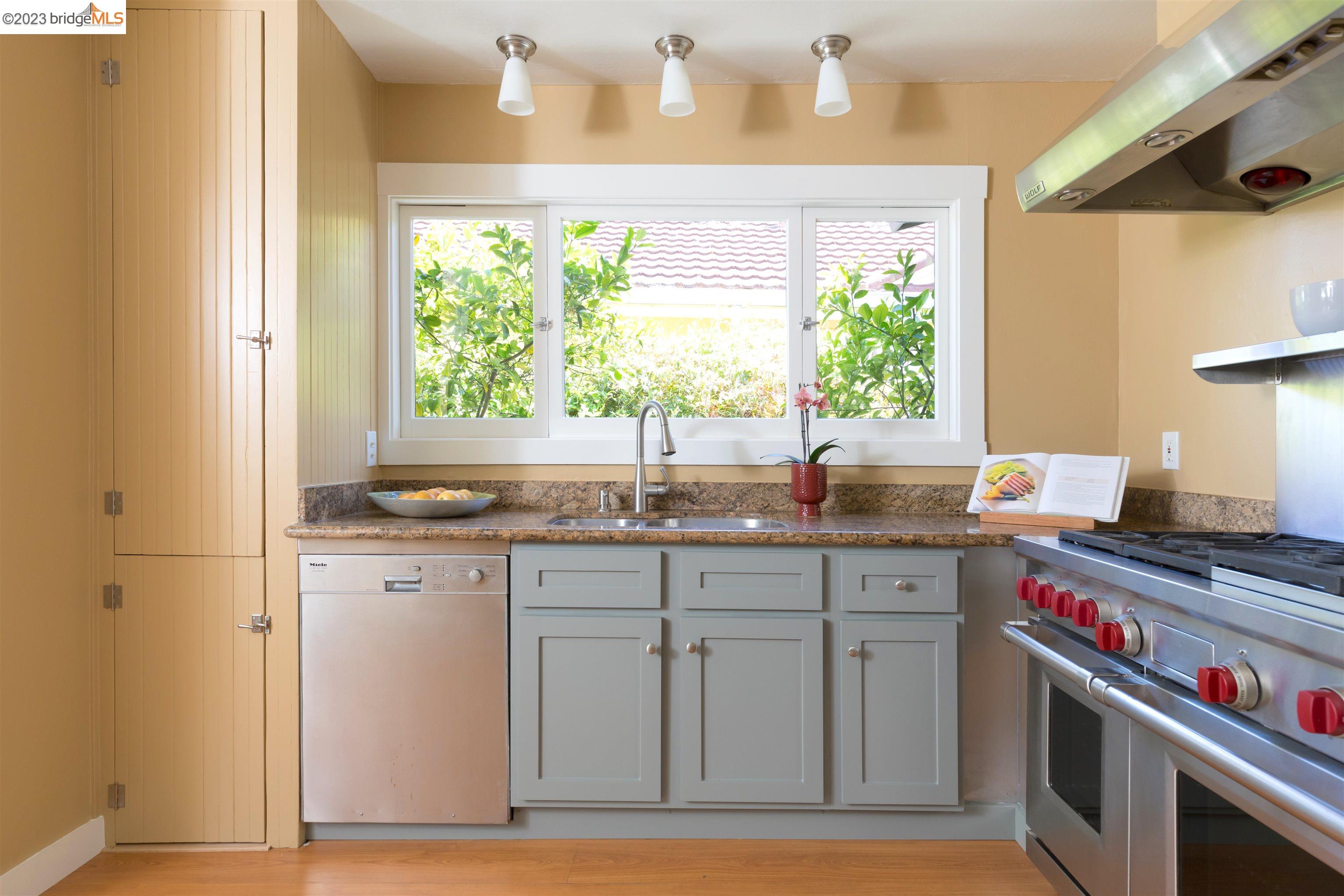 911 Tulare Avenue Berkeley, CA 94707 - Photo 9 of 21 a kitchen with a sink and a stove
