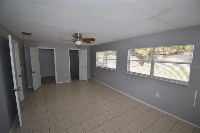 a view of an empty room with a window