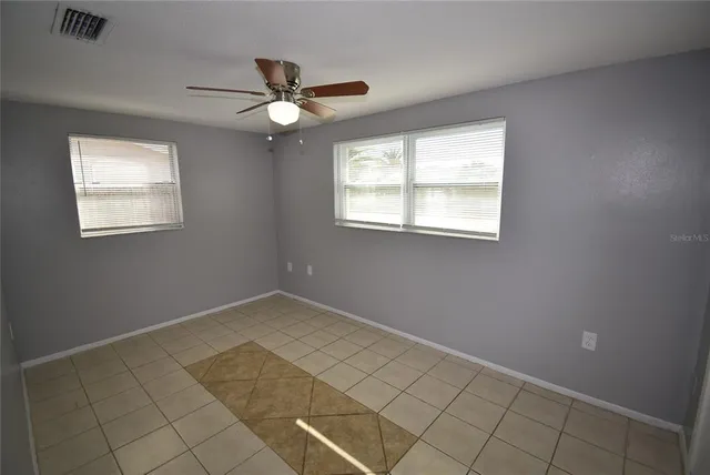 a view of an empty room with a window