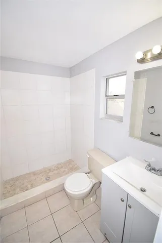 a bathroom with a sink a toilet and a tub