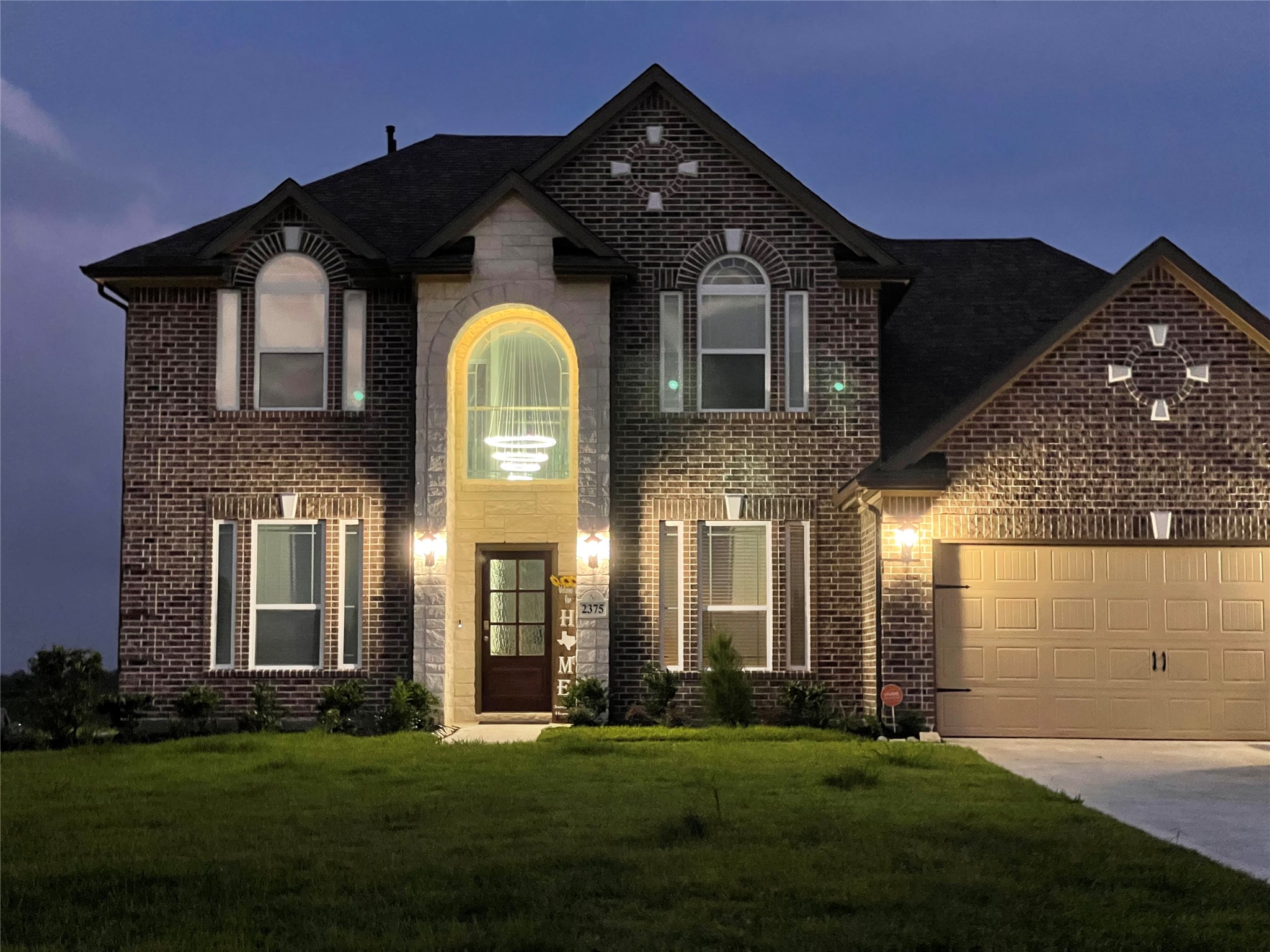 2375 Diamond D Lane Beaumont, TX 77713 - Photo 2 of 43 a front view of a house with a garden