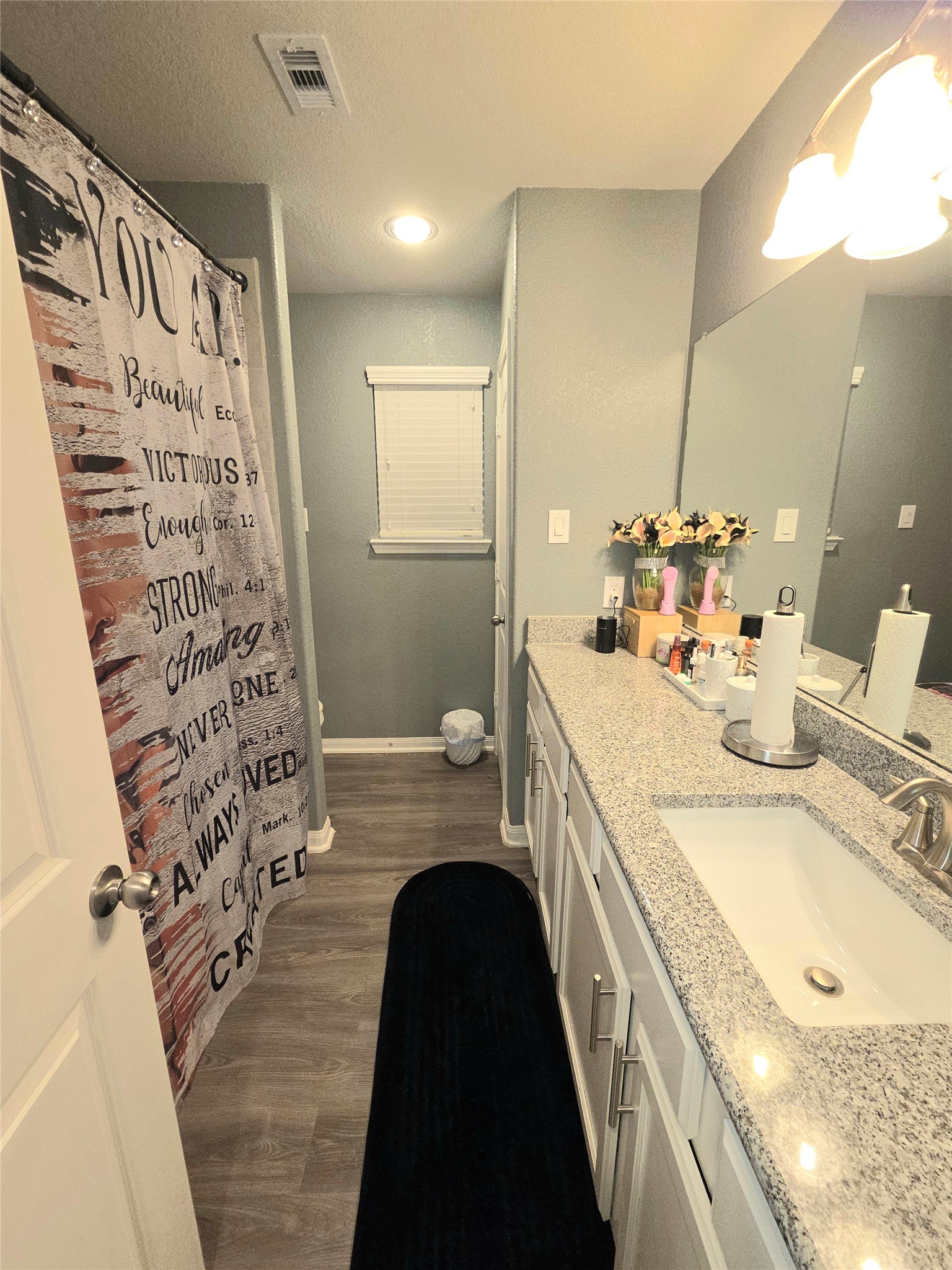 2375 Diamond D Lane Beaumont, TX 77713 - Photo 38 of 43 a bathroom with a double vanity sink and mirror
