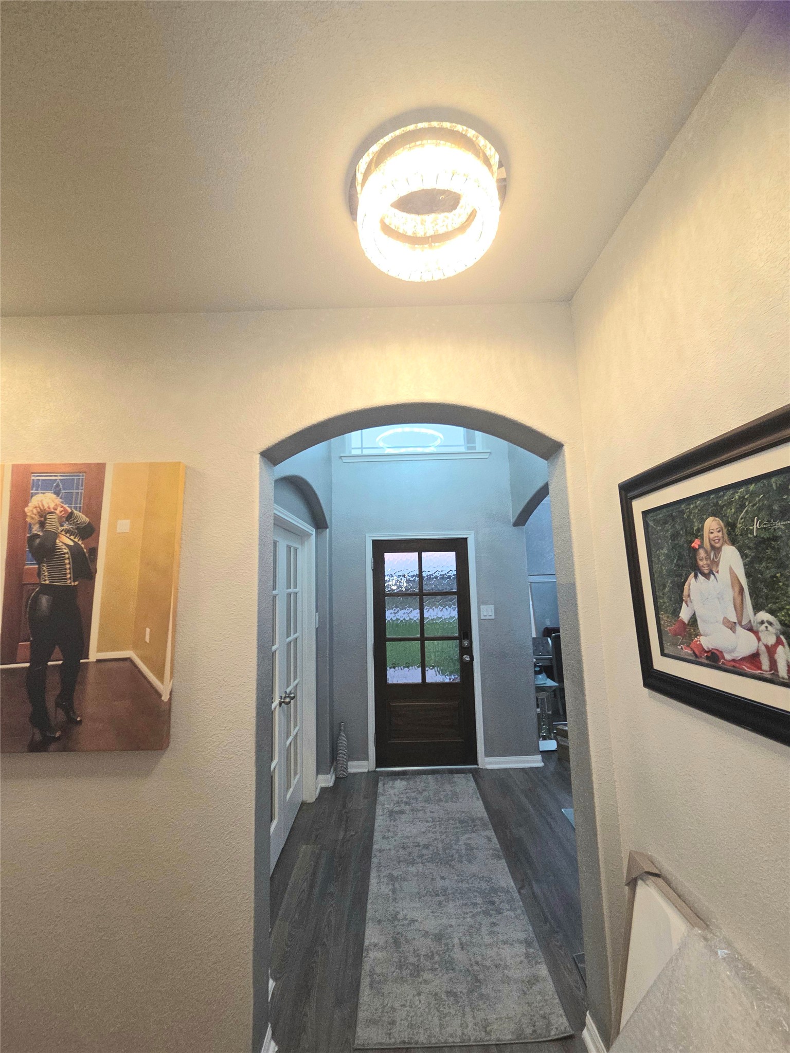 2375 Diamond D Lane Beaumont, TX 77713 - Photo 8 of 43 a view of a hallway with wooden floor and a bookshelf