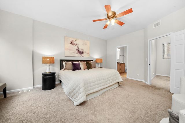 a bedroom with a bed and dresser