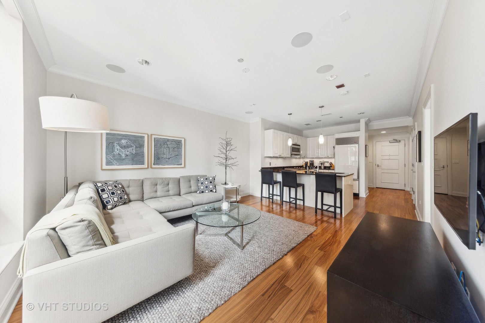 10 East Delaware Place, Unit 19C Chicago, IL 60611 - Photo 7 of 25 a living room with furniture and a table