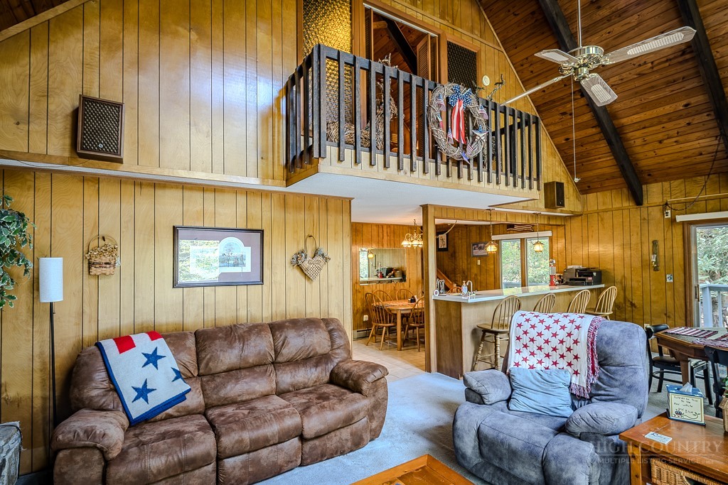 107-109 Shagbark Road Beech Mountain, NC 28604 - Photo 7 of 45 a living room with furniture or couch and a kitchen