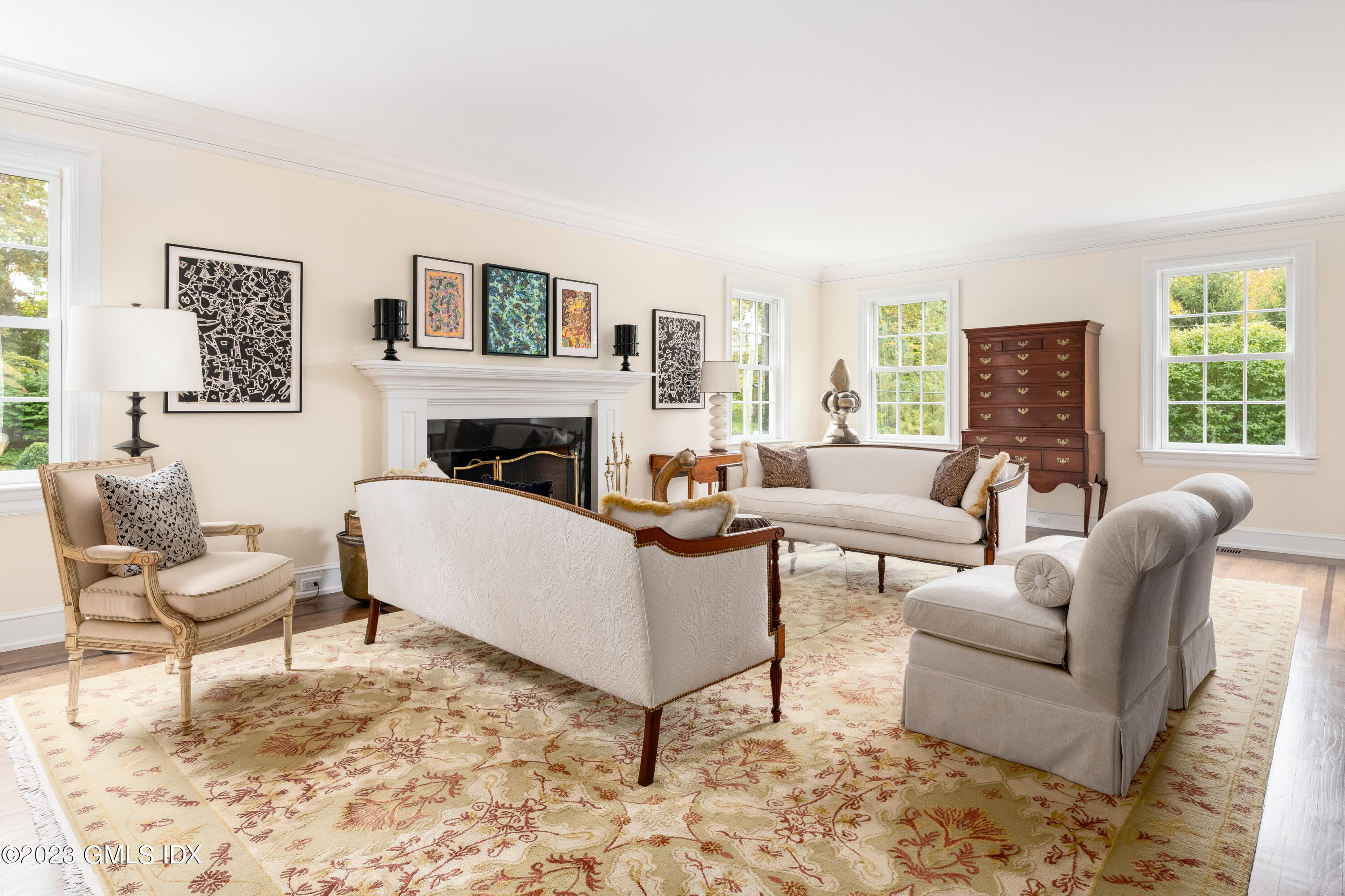 6 Hill Road Greenwich, CT 06830 - Photo 13 of 35 a living room with furniture and a fireplace