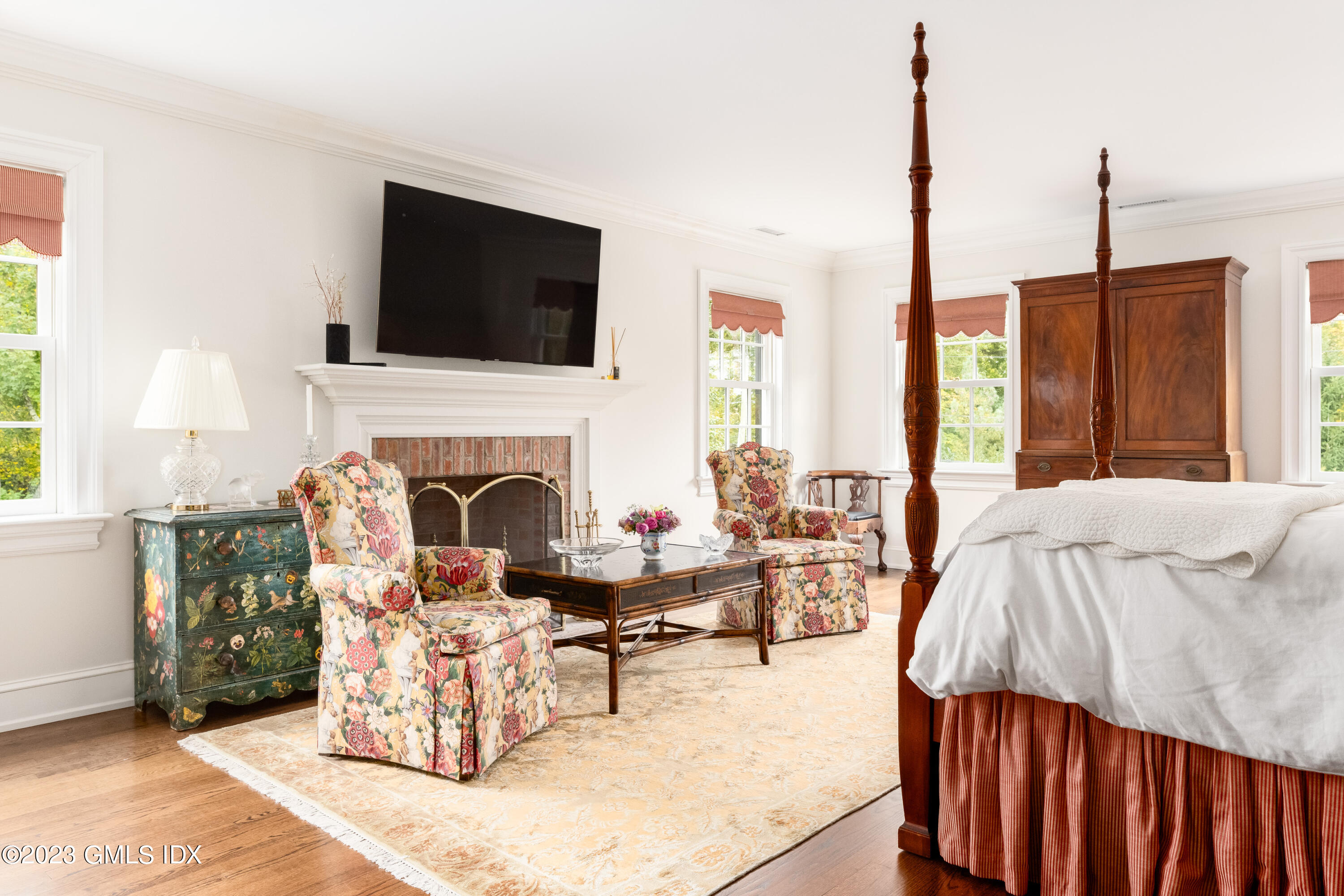 6 Hill Road Greenwich, CT 06830 - Photo 16 of 35 a living room with furniture fireplace and flat screen tv