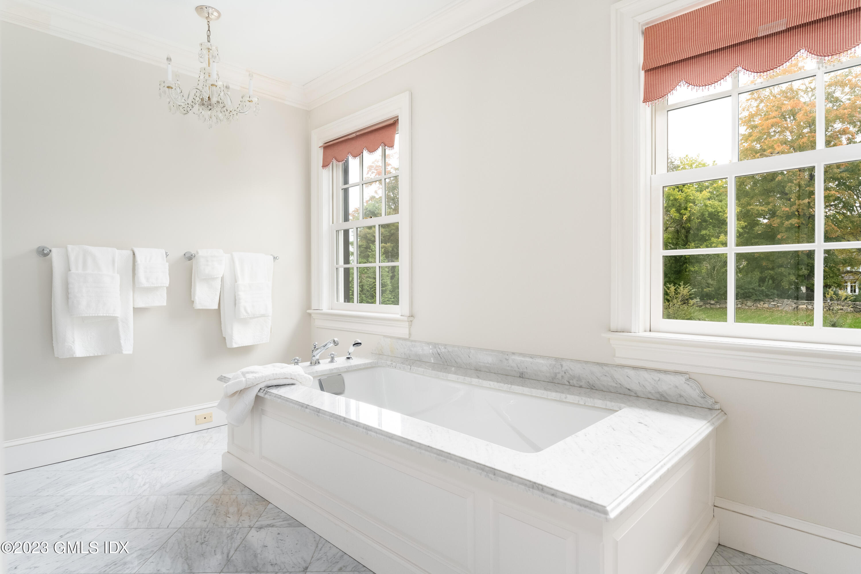 6 Hill Road Greenwich, CT 06830 - Photo 17 of 35 a bathroom with a tub a sink and a window