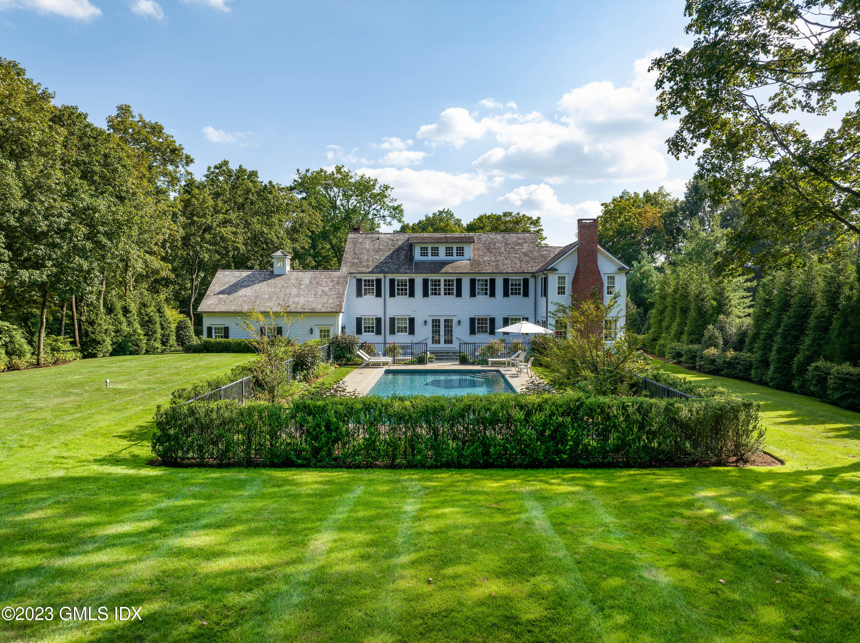 6 Hill Road Greenwich, CT 06830 - Photo 2 of 35 a view of a house with a big yard and potted plants lake view