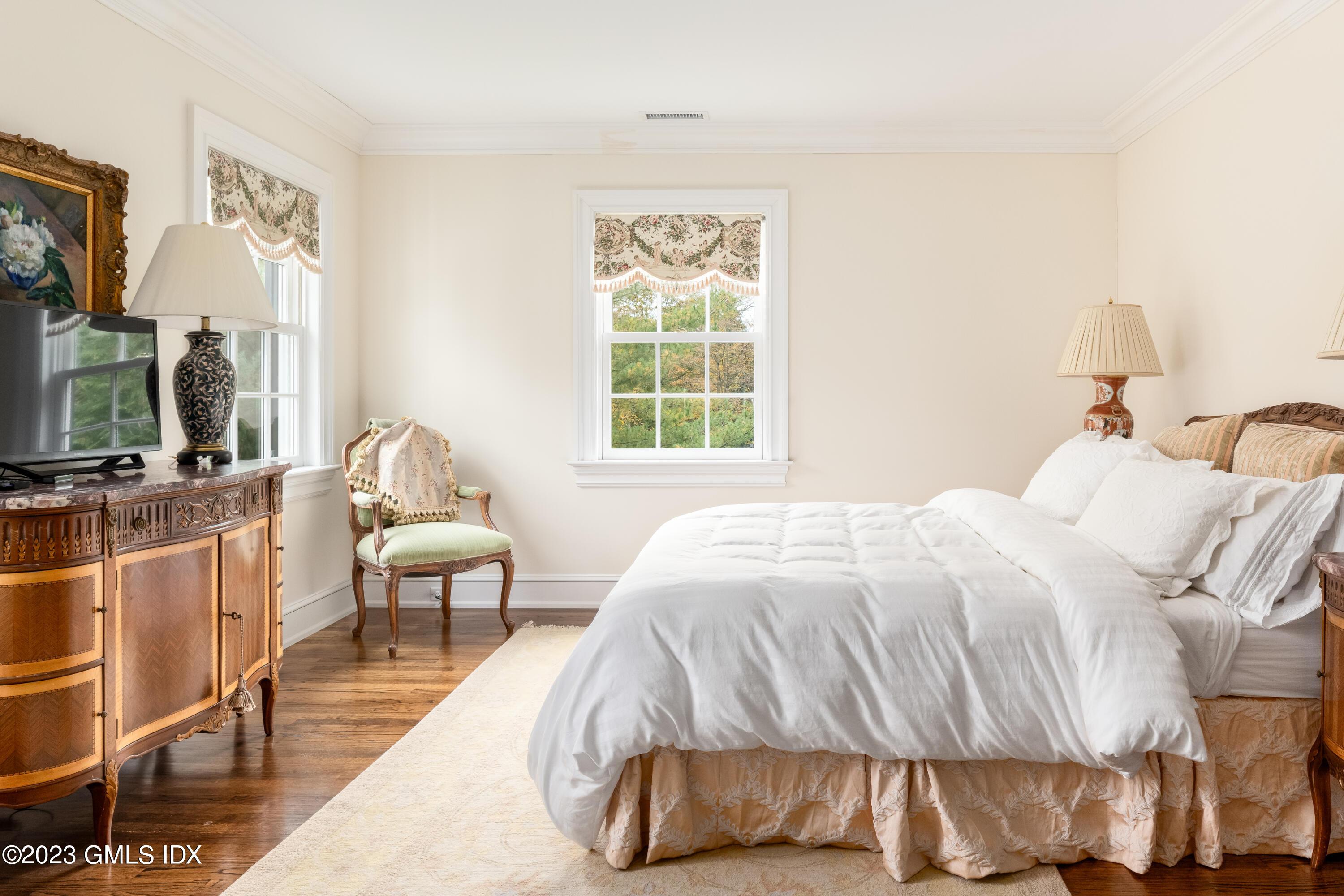 6 Hill Road Greenwich, CT 06830 - Photo 21 of 35 a bedroom with a bed and a flat screen tv