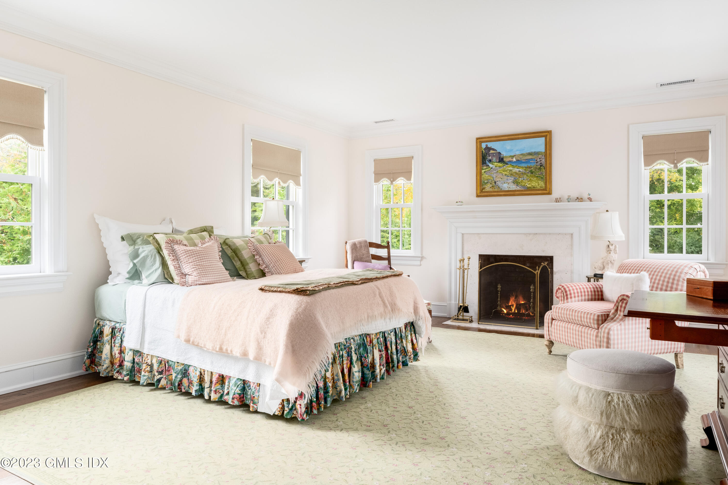 6 Hill Road Greenwich, CT 06830 - Photo 22 of 35 a bed room with a bed and a fireplace