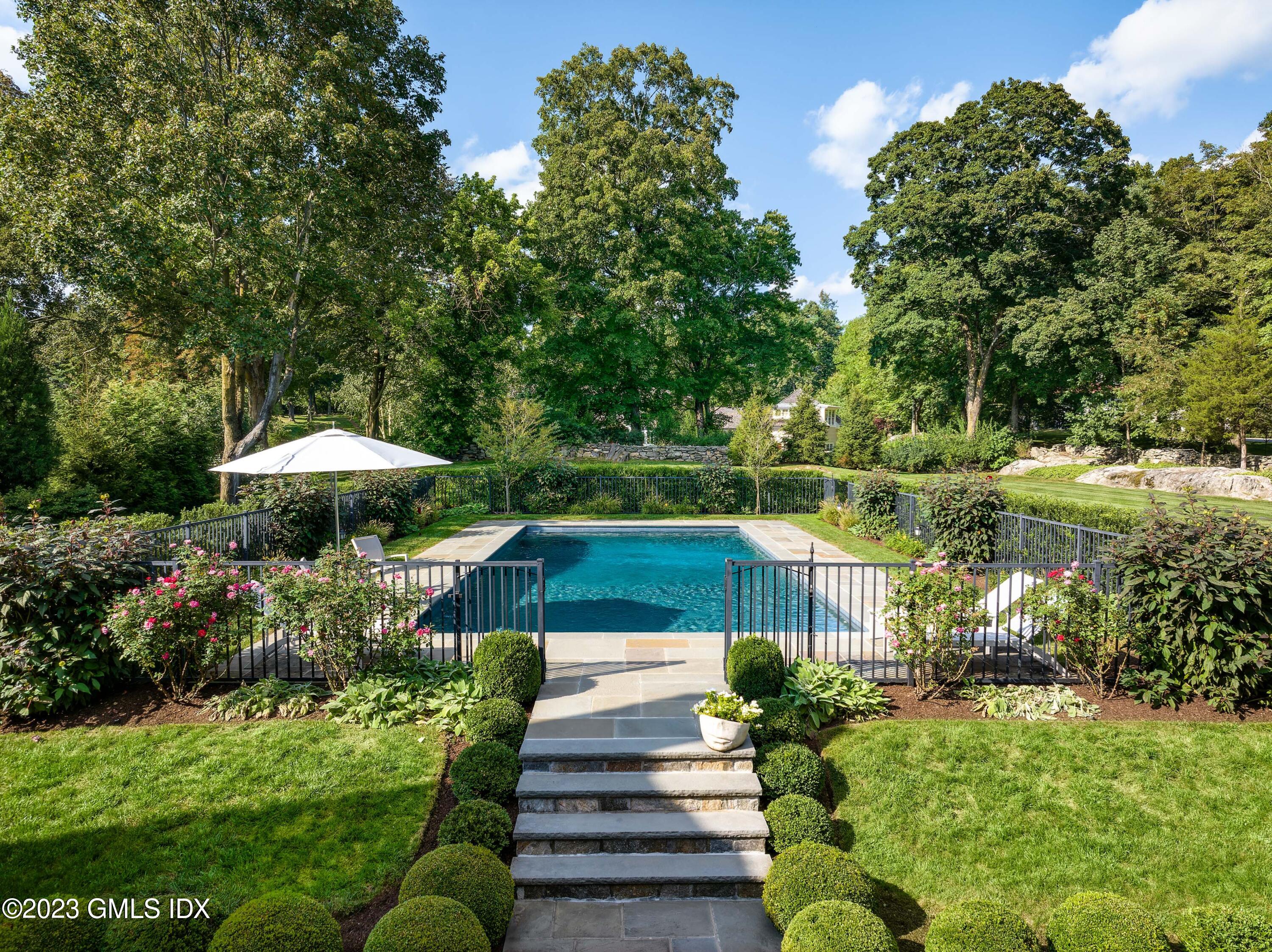 6 Hill Road Greenwich, CT 06830 - Photo 26 of 35 a view of a garden with an outdoor seating